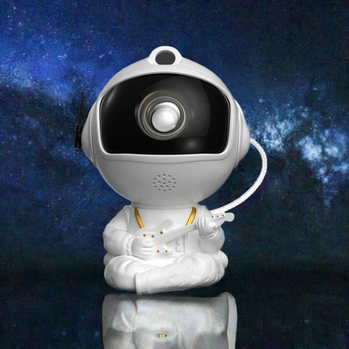 White astronaut projector holding guitar with glowing galaxy background – model C star night light